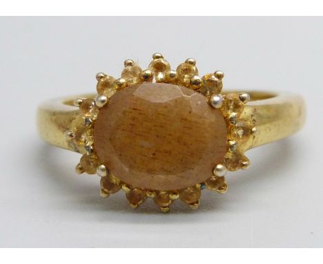 A silver gilt, pink moonstone and citrine cluster ring, S 