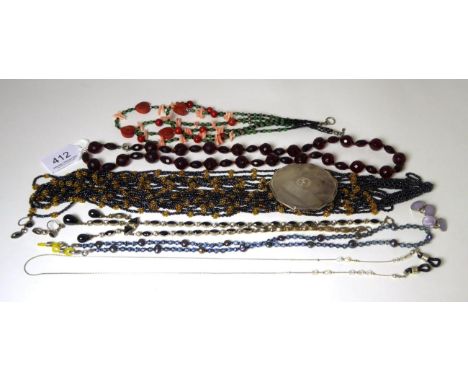 A silver engine turned compact, 6cm in diameter; a faceted bakelite bead necklace, length 70cm, a coral and adventurine quart