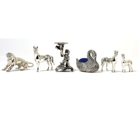 A Silver Swan Pin Cushion, Ari Norman, London 2002, together with: a cast model of a panther, London 2010; three graduated mo