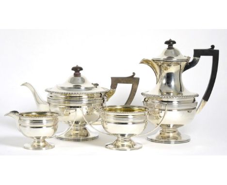 A George V Silver Four Piece Tea Service, Martin Hall & Co Sheffield 1919, circular with gadroon border and on pedestal foot,