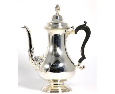 A George III Style Silver Coffee Pot, Camelot Silverware Ltd, Sheffield 1975, plain baluster form on pedestal foot, the domed