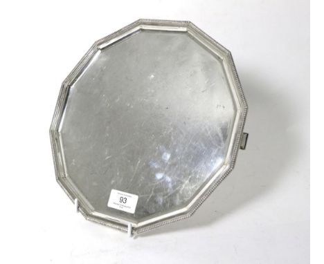 An Art Deco Twelve Sided Silver Salver, Roberts & Belk, Sheffield 1937, with straight gadroon border on four bracket feet 26c
