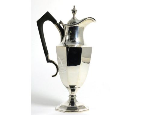 A George V Silver Wine Ewer, William Hutton & Sons, Sheffield 1911, the octagonal body on conforming pedestal foot, 28cm high