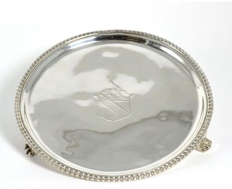 A George III Circular Silver Salver, maker's mark indistinct, Sheffield 1814, with gadroon border and on three bracket feet, 