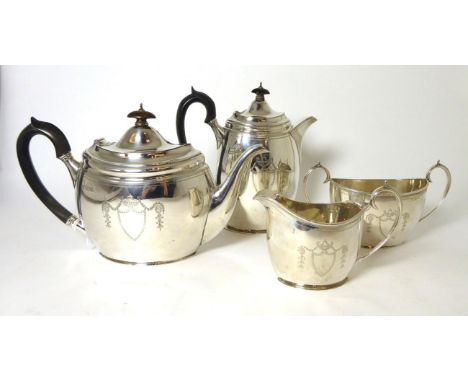 A matched four piece silver tea service, Pearce & Sons, London 1905 and Fattorini & Sons, Sheffield 1932, of George III style
