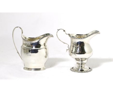 A George III Silver Cream Jug, maker's mark rubbed, London 1799, with reeded borders and handle; and A George III Style Silve