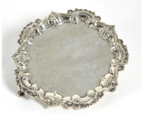 An Early Victorian Silver Small Salver, John Tapley, London 1843, with foliate scroll and shell rim, on three foliate bracket