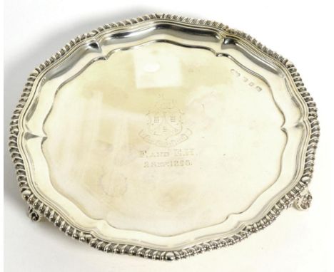 A Late Victorian Silver Salver, Elkington & Co, Birmingham, 1895, shaped circular with gadroon rim and on bracket feet, engra
