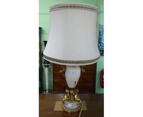 A large gilt metal mounted table lamp featuring putti, 54cm high excluding fitting 