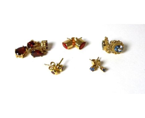 Five pairs of 9 carat gold gem set earrings comprising of ruby, sapphire, fire opal, garnet and aquamrine, with post fittings