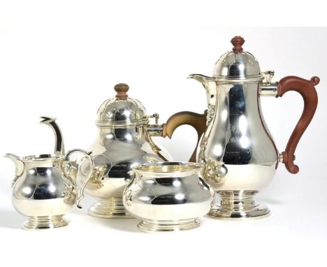 A Silver Four Piece Tea Service, William Comyns, London 1940, plain baluster form, the covers with strapwork type decoration,