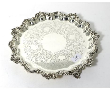 An Edwardian Circular Silver Salver, Marples & Co, Sheffield 1907, with elaborate shaped C scroll and foliate rim, foliate en