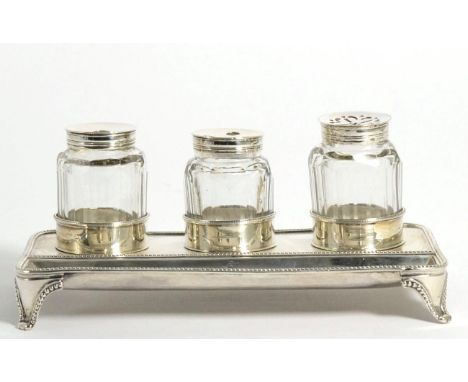 A George III Silver Inkstand, Robert Hennell, London 1787, rectangular with bead borders, a pen depression to the front and t