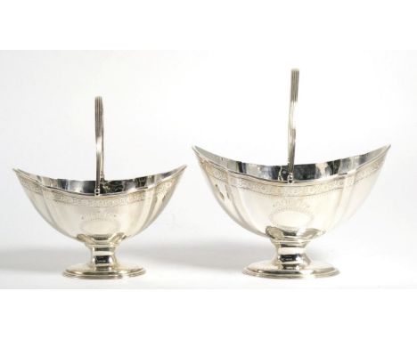 A Graduated Pair of George III Silver Swing Handled Sugar Baskets, John Harris III, London 1787, with reeded rims and handle,