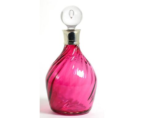 A Silver Mounted Cranberry Glass Decanter, D & PB, Birmingham 2003, with spirally fluted glass body, 27cm high including stop