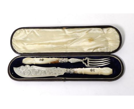 A Pair of Small Victorian Silver Fish Servers, George Unite, Birmingham 1852, with engraved blade and tines, the carved mothe