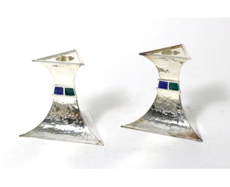 A Pair of Silver and Enamel Candlesticks, maker's mark ASL, Birmingham 2010, of triangular form with planished finish and alt