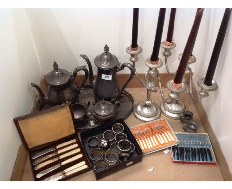 Remaining contents to tray - two plated candelabra, four piece plated tea service, oval tray, napkin rings etc. 