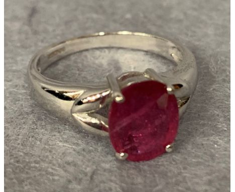 A white gold and "Royal Ruby" set ring, claw  mounted, stamped 9k (approximate weight 3.5g)