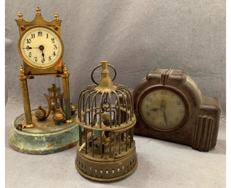 Three items - a brass skeleton clock (no covers), a small singing bird automaton and a Bakelite mantel clock - all as viewed 