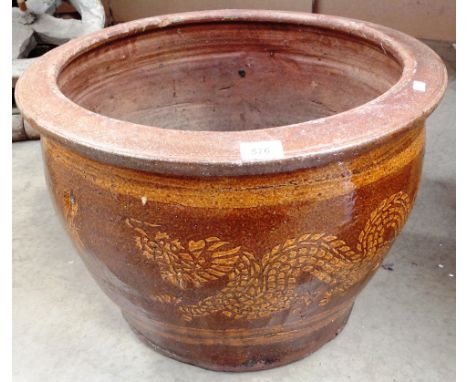 A large brown glazed planter 54cm diameter and 38cm high 