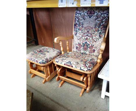 A light oak finish American style country rocker armchair and matching stool with floral pattern upholstery 