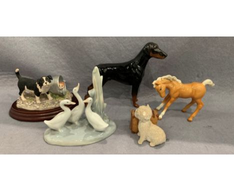 A Royal Doulton model of a Doberman, a Beswick Pony, a Nao model of ducks, a Border Fine Arts model by Anne Wall 'Hide and Se