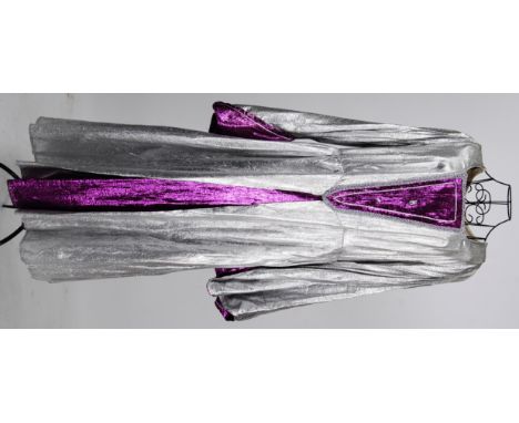 PANTOMIME: A silver and purple coloured glittery lame pantomime Dame dress, medieval in style.


NOTE: From a large private c