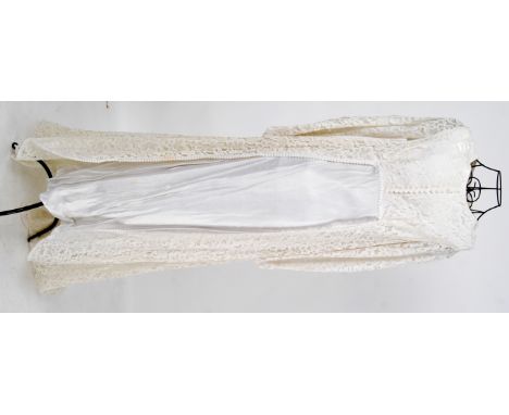 WEDDING DRESS: An original vintage 1970's lace and satin ivory wedding dress.


NOTE: From a large private collection of asso