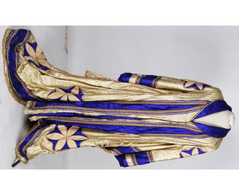 JAPANESE: A Japanese Emporer style coat , fully lined lame with applied motifs and braiding  plus waist obi 

NOTE: From a la