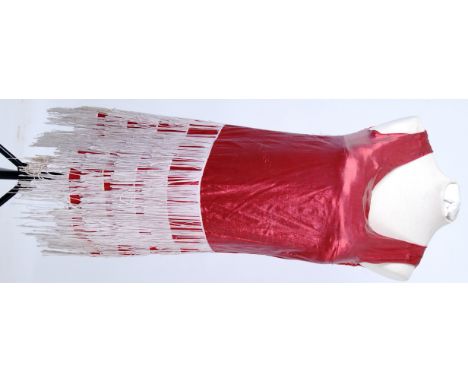 1920's FLAPPER: A 1920's style Flapper dress in red Lame with several layers of cream fringing to lower half.

NOTE: From a l