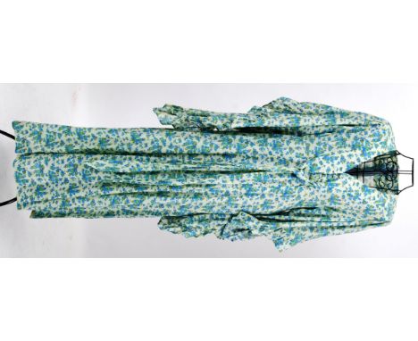 MAXI DRESS: An original 1960's floral Maxi dress with bat-wing frilled sleeves and button to front.

NOTE: From a large priva