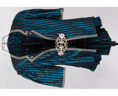 TAILCOAT: A satin striped tunic jacket / tailcoat with white metal clasp . Fitted and buttoned to waist at rear with short pl