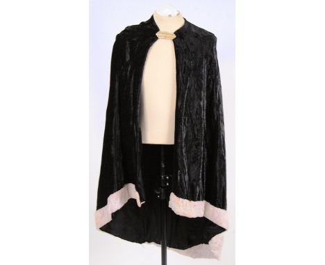 SHAWL: A vintage crushed blank velvet long shawl with white faux fur trim and and a white metal neck clasp.

NOTE: From a lar