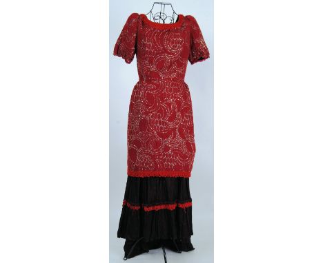 EDWARDIAN DRESS: An Edwardian plum coloured evening dress, with front pannier. The top decorated with silver colour thread. 
