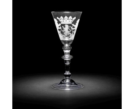 A Dutch engraved armorial light baluster wine glass, circa 1750The round funnel bowl with the crowned arms of South Holland f