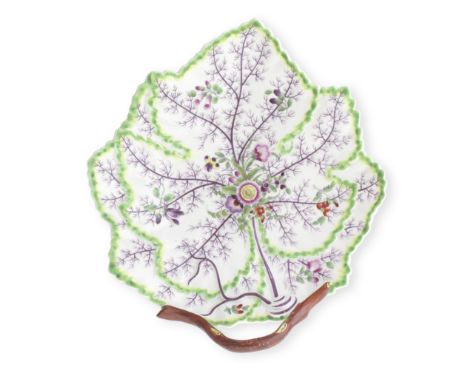 A Worcester leaf dish, circa 1770Formed as two overlapping leaves, with a curled stalk handle, painted with flowers and unusu