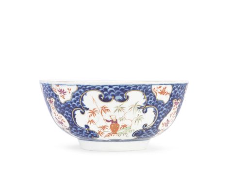 A Worcester bowl, circa 1767-68From the Bodenham service, finely potted and painted with a blue scale ground reserving rococo