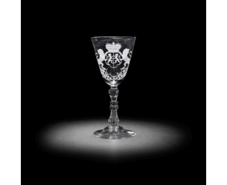 A Dutch engraved armorial light baluster goblet, circa 1750The generous round funnel bowl with the crowned arms of Gelderland
