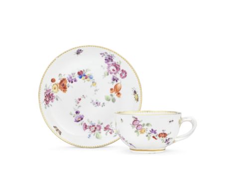 A Worcester teacup and saucer, circa 1770Decorated in the Giles workshop with floral garlands forming a spiral, the cursive f