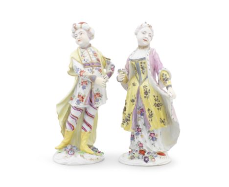 A rare pair of Derby figures, circa 1765Modelled as a Turk and a Levantine lady in colourful Turkish dress, the low scroll-mo