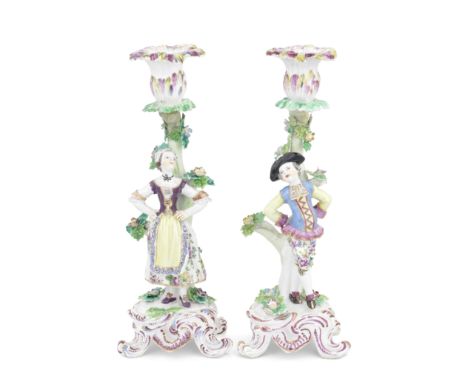 A pair of Bow candlestick figures of 'Dutch Dancers', circa 1765In dancing attitude, she with her hands on her hips, he with 