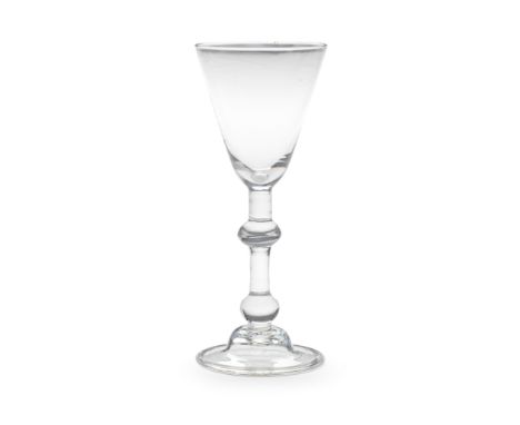 A good light baluster wine glass, circa 1740The generous round funnel bowl on a slender stem with a central angular knop and 