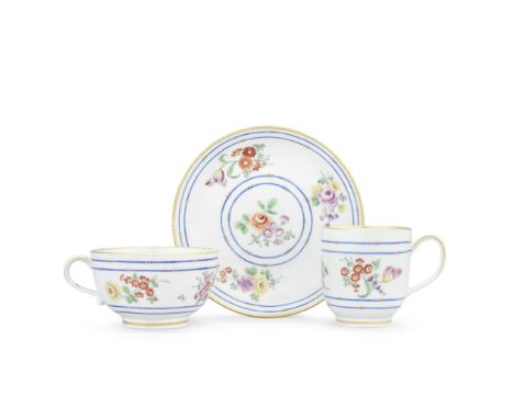 A good Worcester teacup, coffee cup and saucer, circa 1770-72Painted in the Giles workshop with loose flower sprays between b