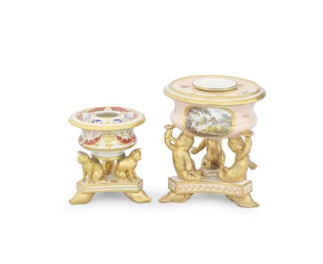 Two rare Derby inkwells, circa 1815Of circular form on triangular bases with gilded supporters and conch shell feet, one with