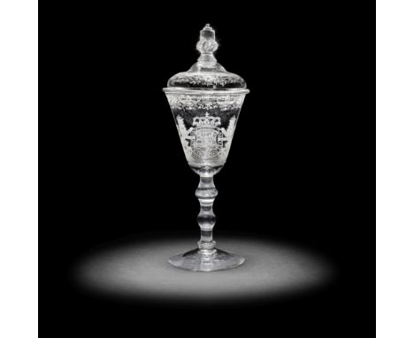 A fine and impressive Dutch engraved Royal armorial light baluster goblet and a cover, circa 1750The generous round funnel bo