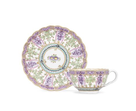 A Worcester teacup and saucer, circa 1775Of reeded French shape, richly decorated with the 'Holly Berry' pattern, panels of p