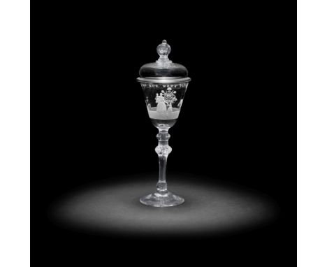 An exceptional Dutch engraved light baluster goblet and cover signed by Jacob Sang, dated 1760The round funnel bowl with a co