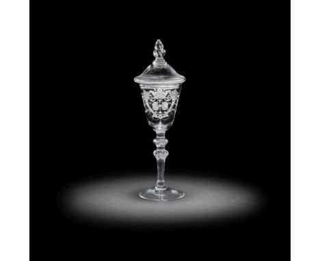 A fine Dutch engraved light baluster 'Friendship' goblet and cover attributed to Jacob Sang, circa 1760The round funnel bowl 