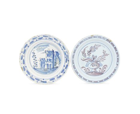 Two London delftware plates, circa 1715-40Of so-called 'pancake' shape, painted in blue and manganese with an urn overflowing